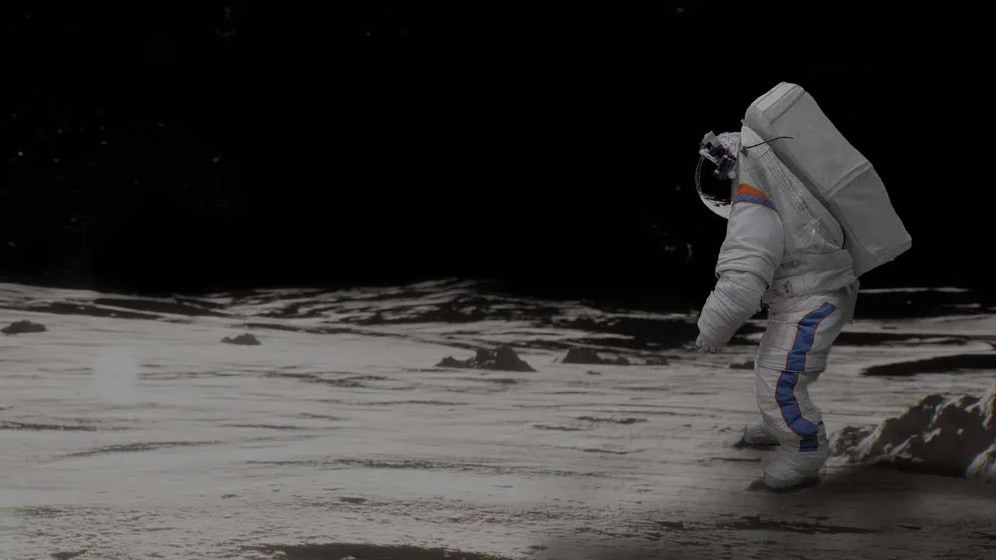 Astronaut in suit on surface of the moon