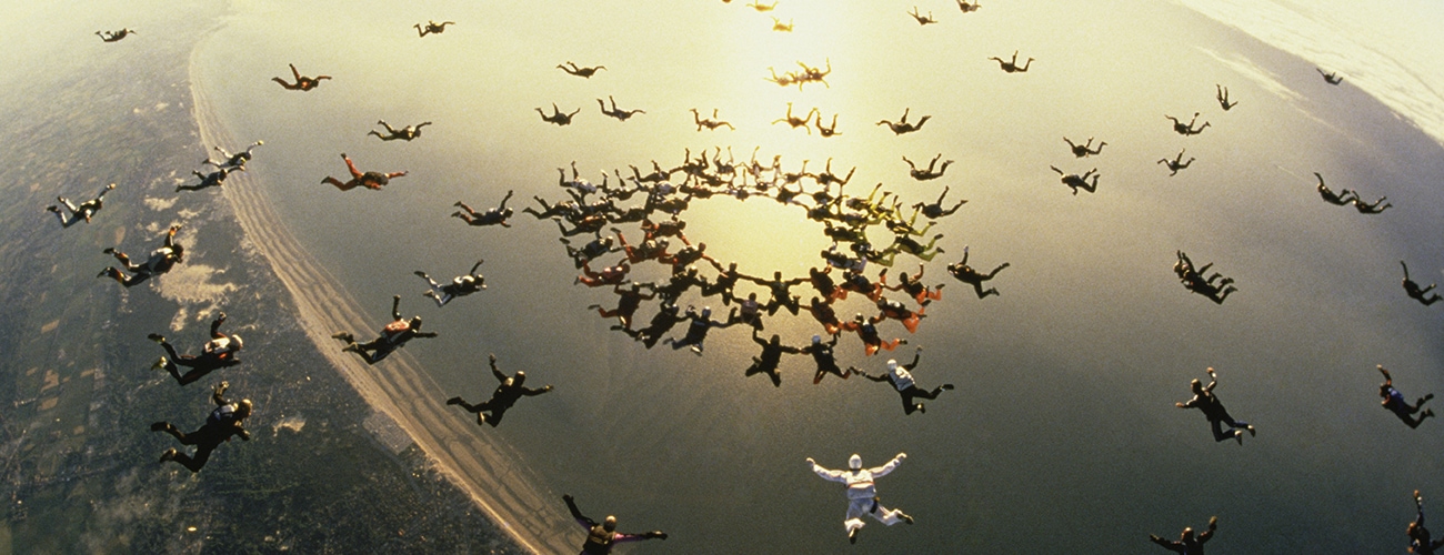 Skydivers in the clouds