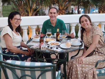 3 people sitting by a table