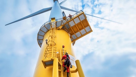 man_climbing_wind_turbine