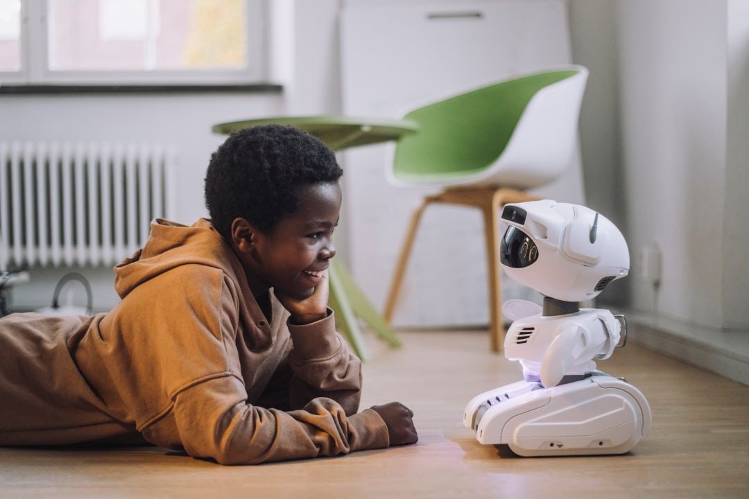 boy interacting with robot