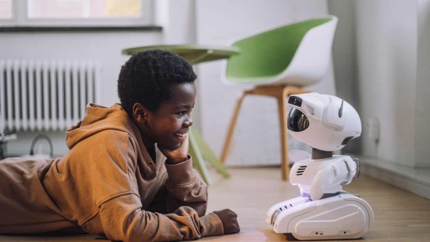 boy interacting with robot