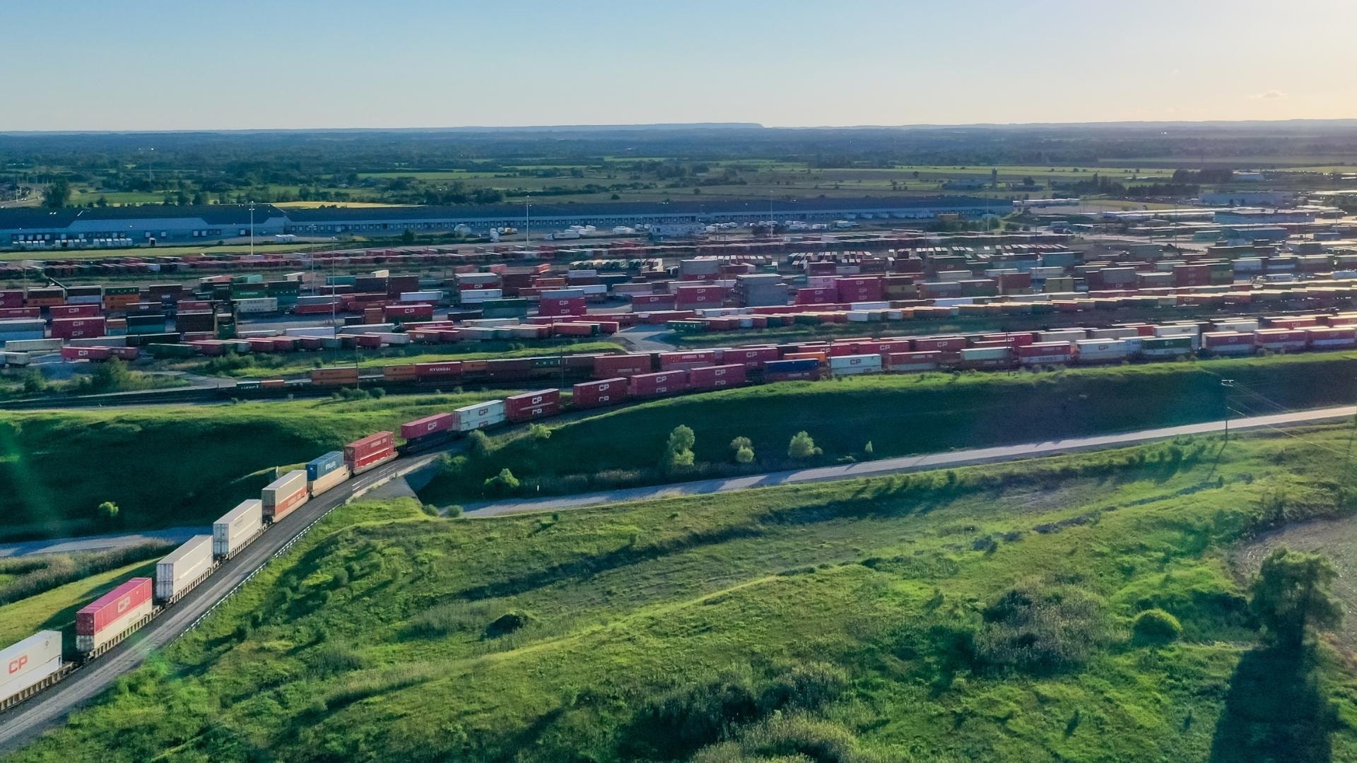 An image showing a railway yard filled with trains.