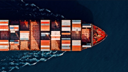 Cargo ship at sea seen from above