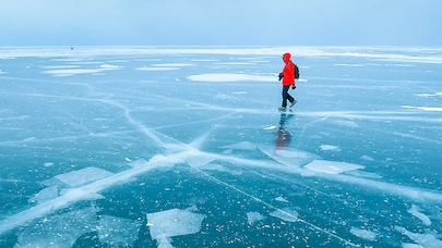 man on frozen lake