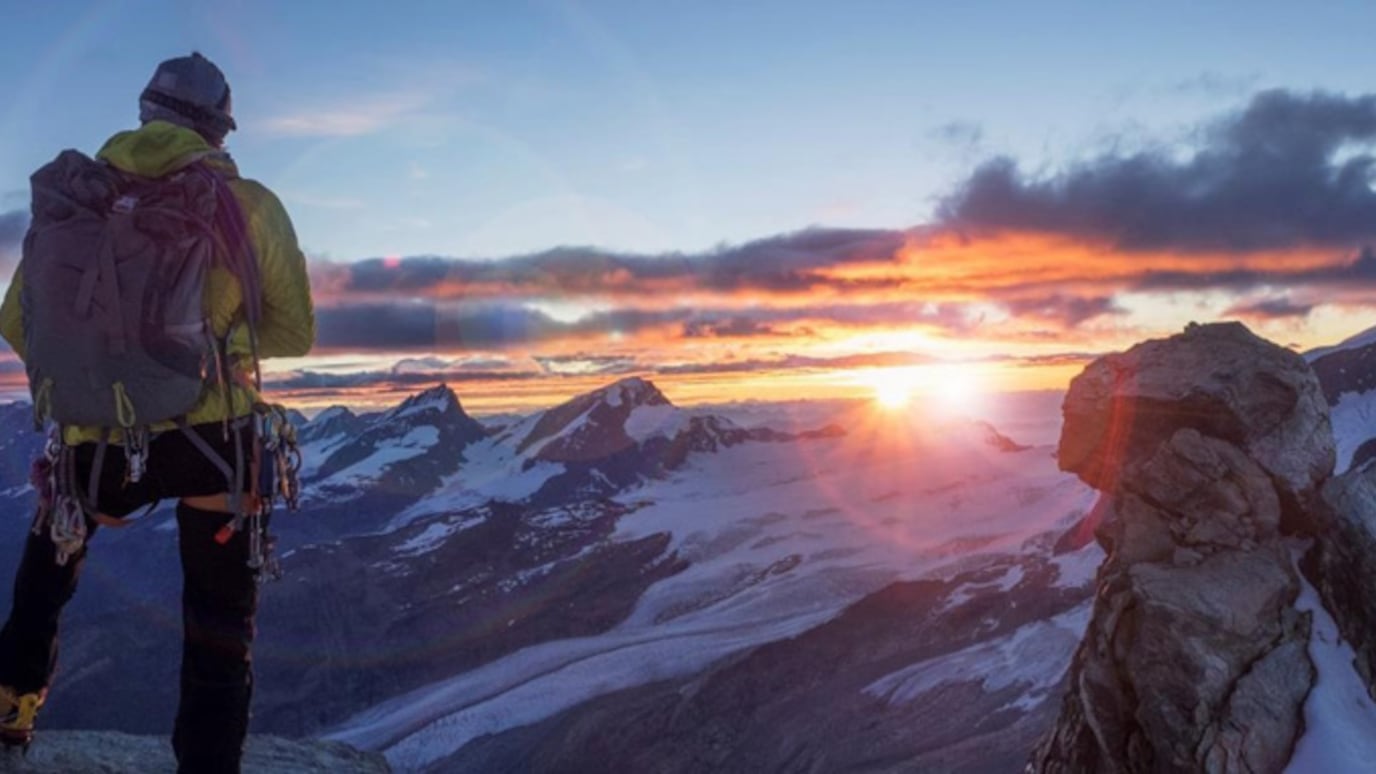 A climber on top of a mountain