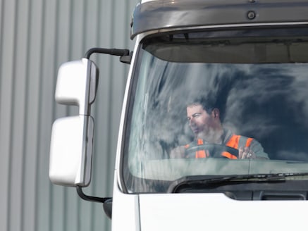 truck driver seeing in rear mirror