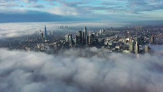 City seen beyond clouds