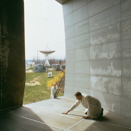 Penzias & Wilson working on the antenna