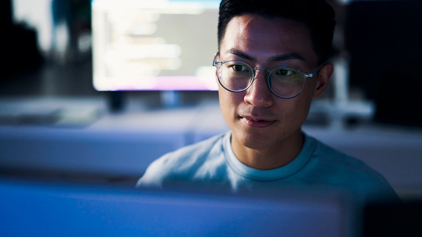 man working on monitor