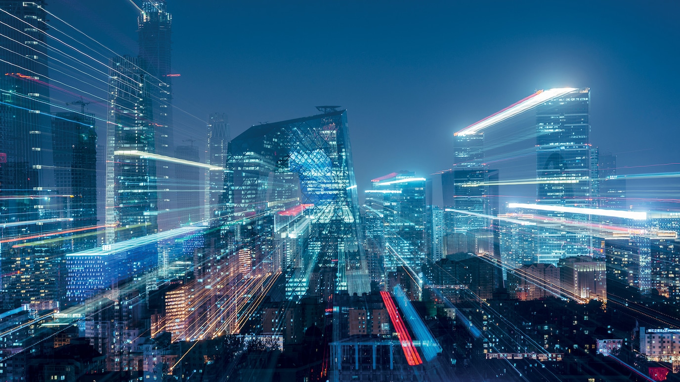 Blurred photograph of city buildings at night