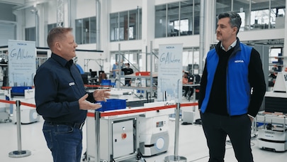 Nokia colleagues discussing in a Nokia factory