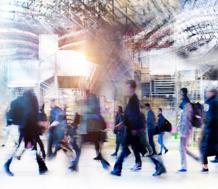 Blurred motion image of a busy indoor public space