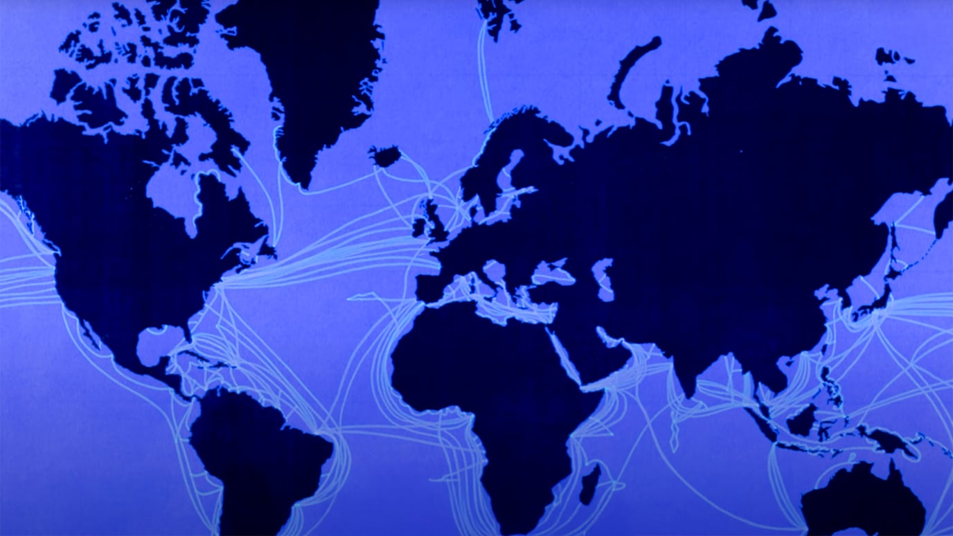 Map of the globe with glass fiber routes traced over