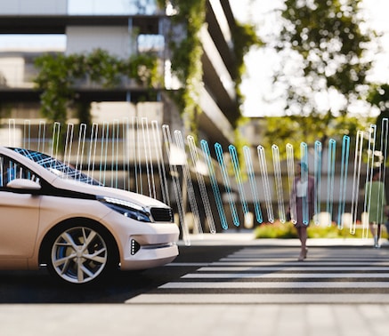 A car with advanced sensor technology depicted by stylized lines projecting forward