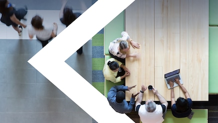 Overhead view of people at table having a meeting