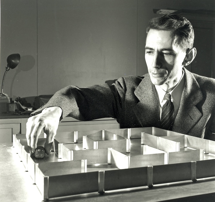 Claude Shannon and Theseus, a robotic maze-solving mouse and one of the world’s first examples of machine learning.