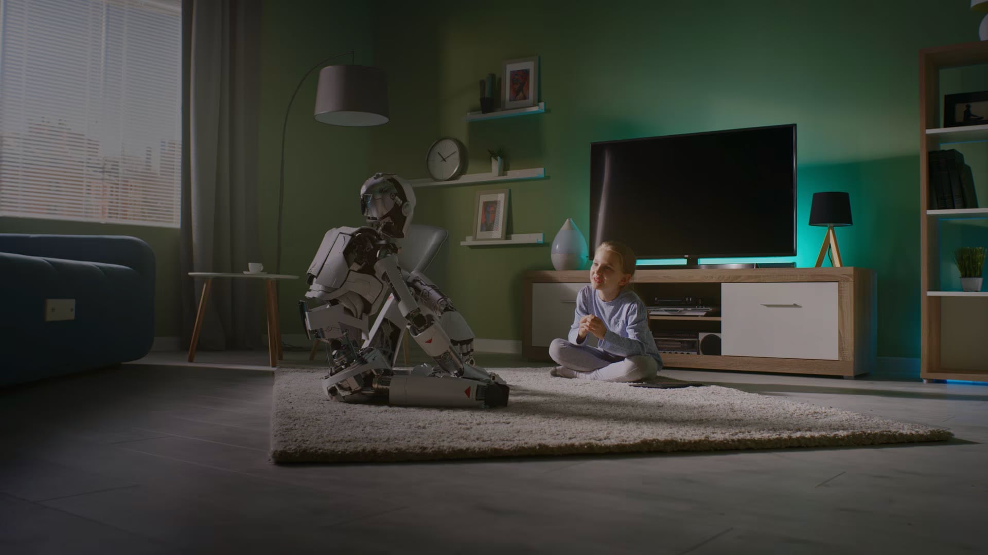 Girl and robot watching TV in living room