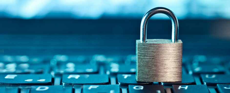 A close-up image of a physical lock placed on top of a keyboard, symbolizing security