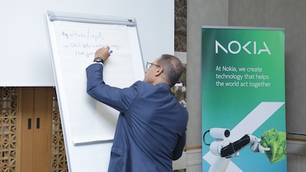 Man writing on flip chart