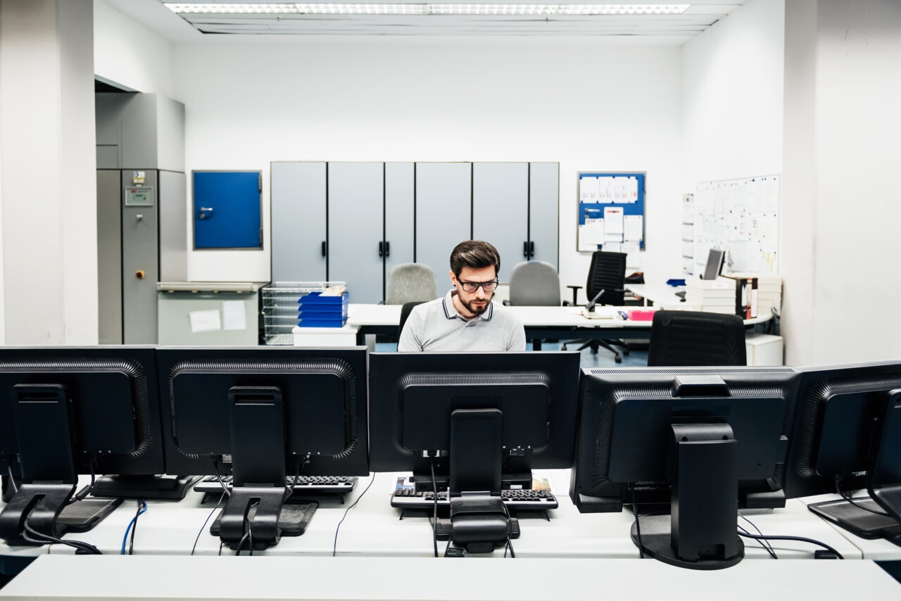 A man working on a computer in an office