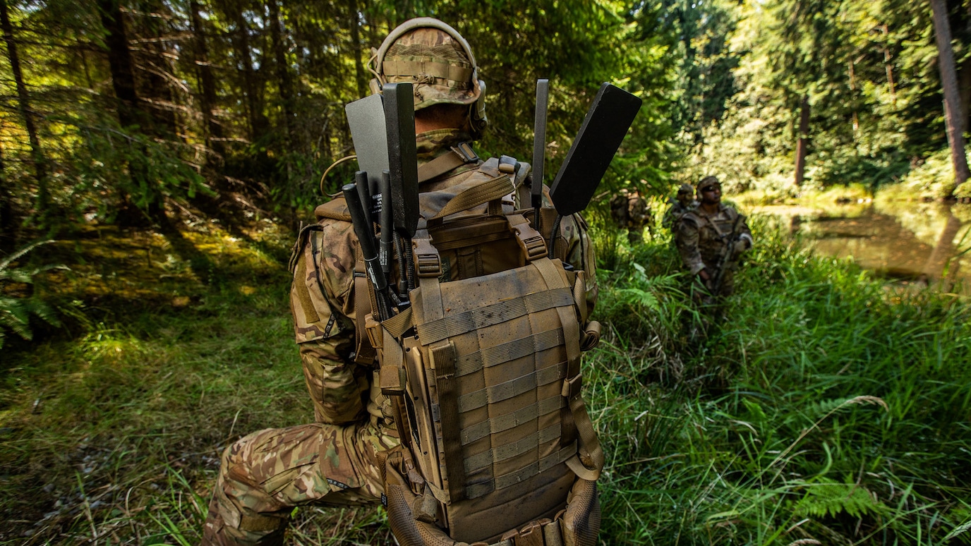 SOldier in the field with tactical radio