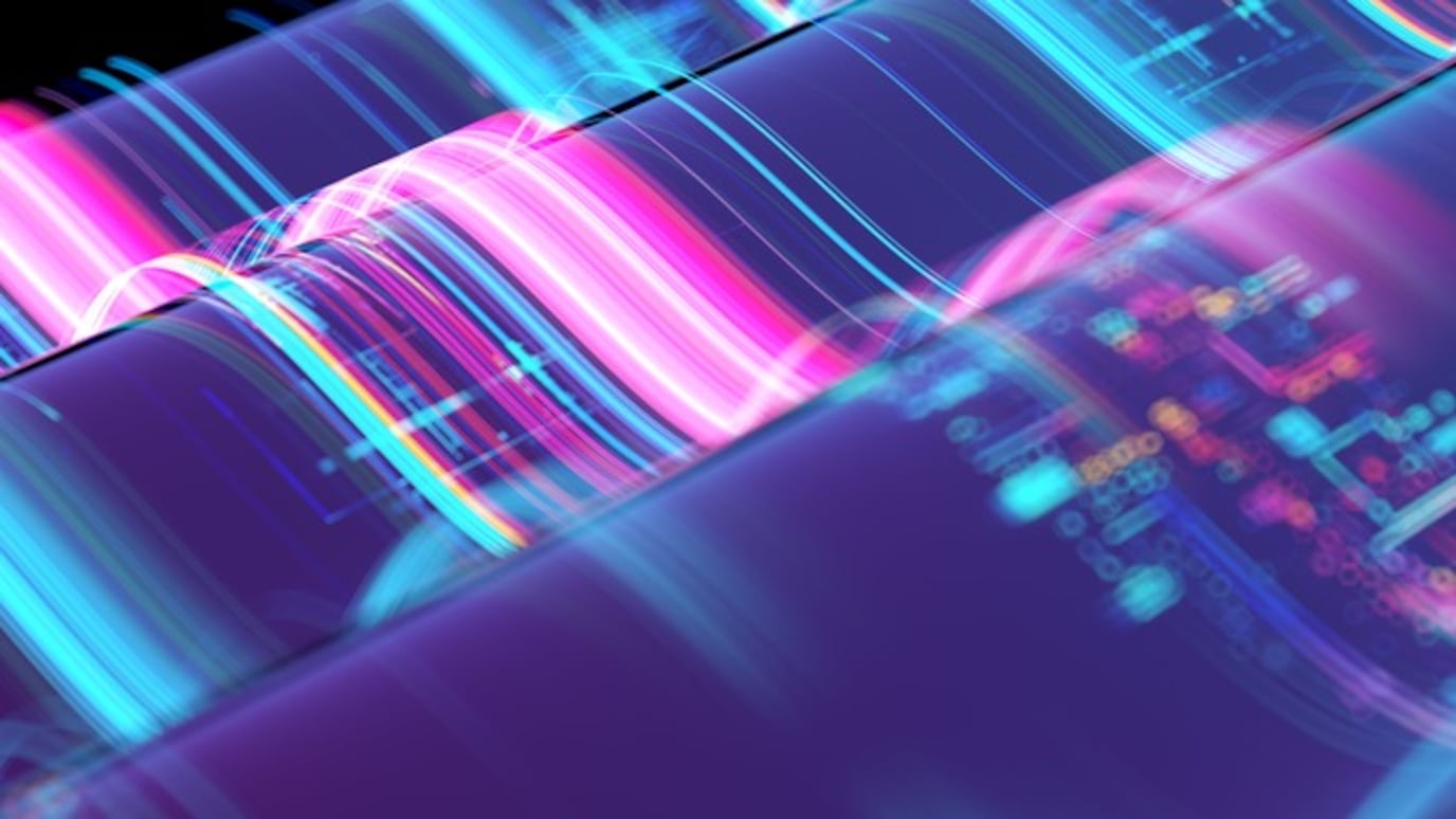 Abstract digital wave with neon pink and blue light trails over circuits, symbolizing data, AI, and futuristic technology.