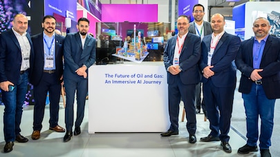 GITEX 2025 - Six Nokia colleagues give a thumbs-up on the Nokia booth at GITEX