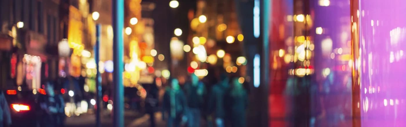 A blurry image of colourful city night lights.