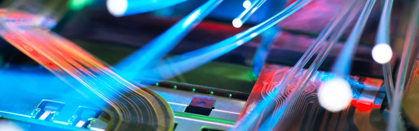 A close-up colourful image of optical fibre cables.