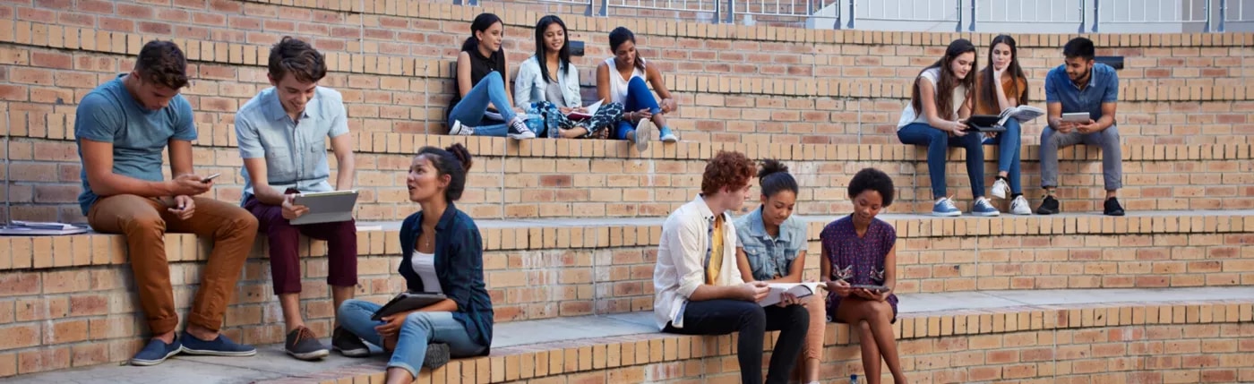 An image of people sitting on big stairs.