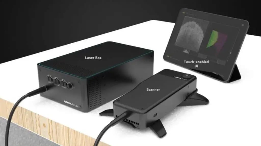 Medical endoscopy system with laser box, handheld scanner, and touch-enabled display showing medical images.