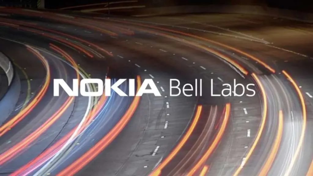 The Nokia Bell Labs logo superimposed on a blurred background of a highway at night. 