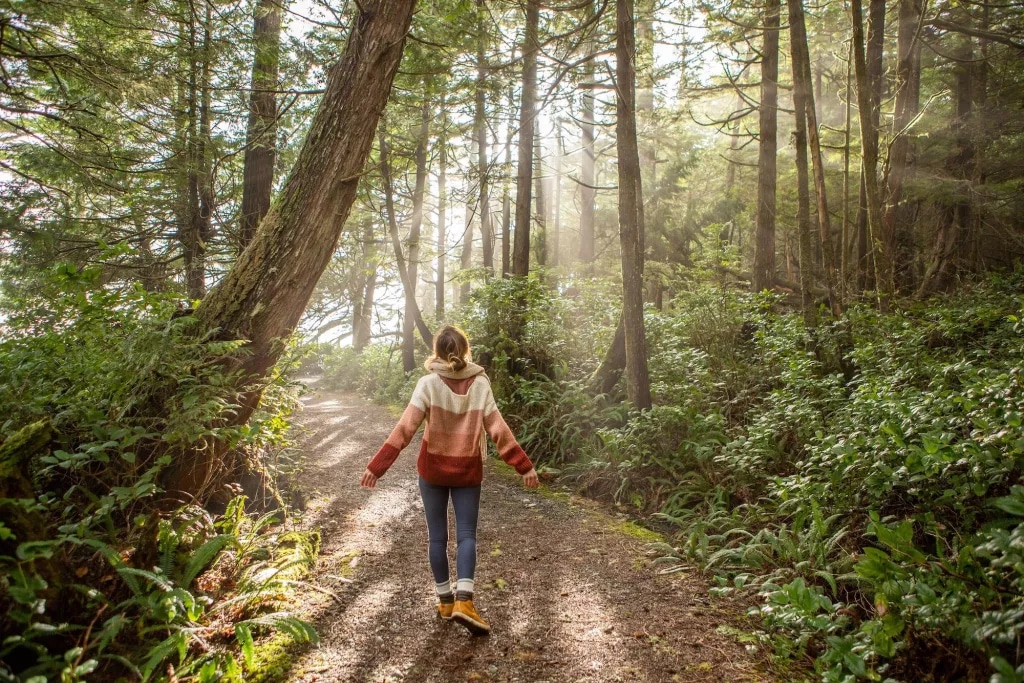 Woman walking in the woods