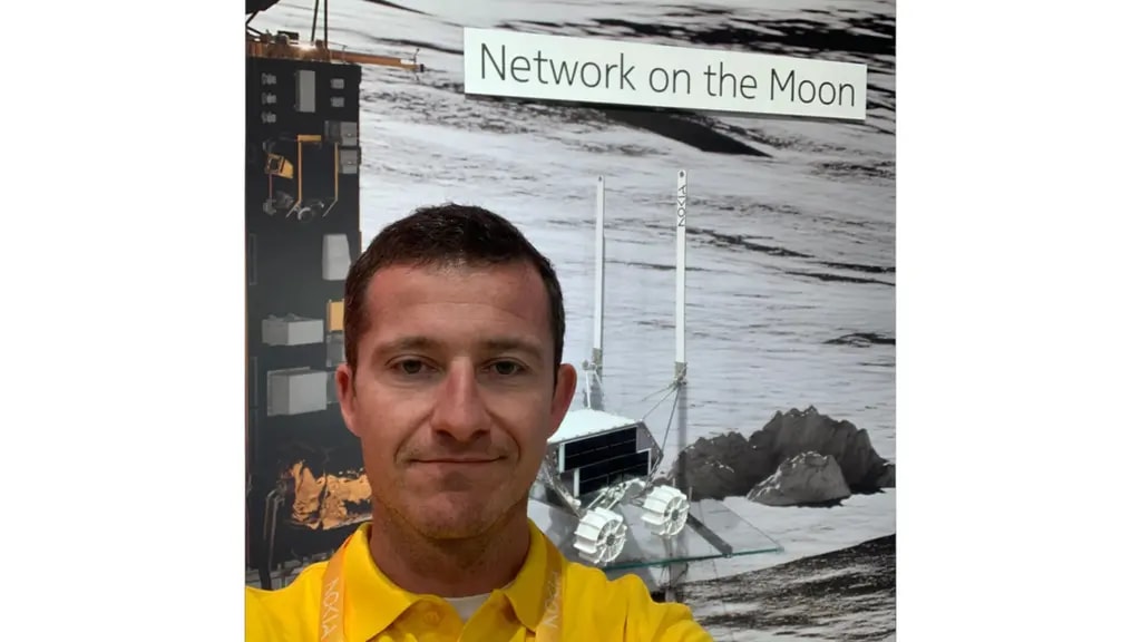 Luis Maestro in front of a Network on the Moon display area