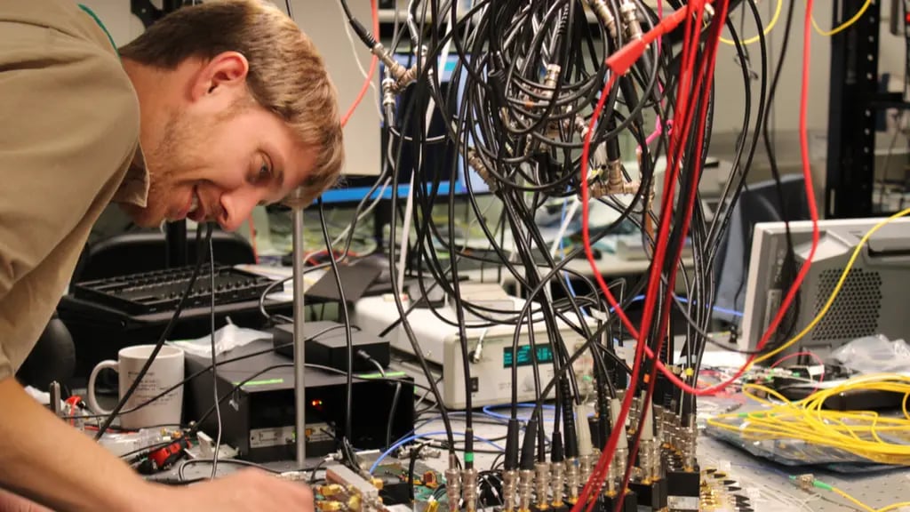 Mikael Mazur working on some electronic equipment