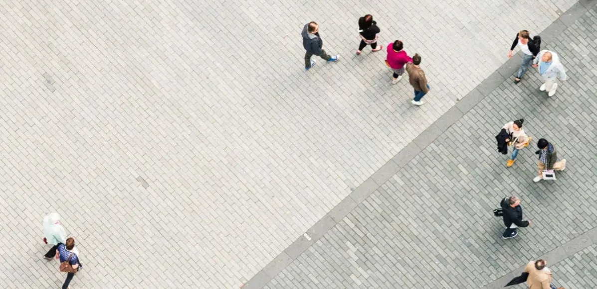 Overhead shot of people walking on brick walkway