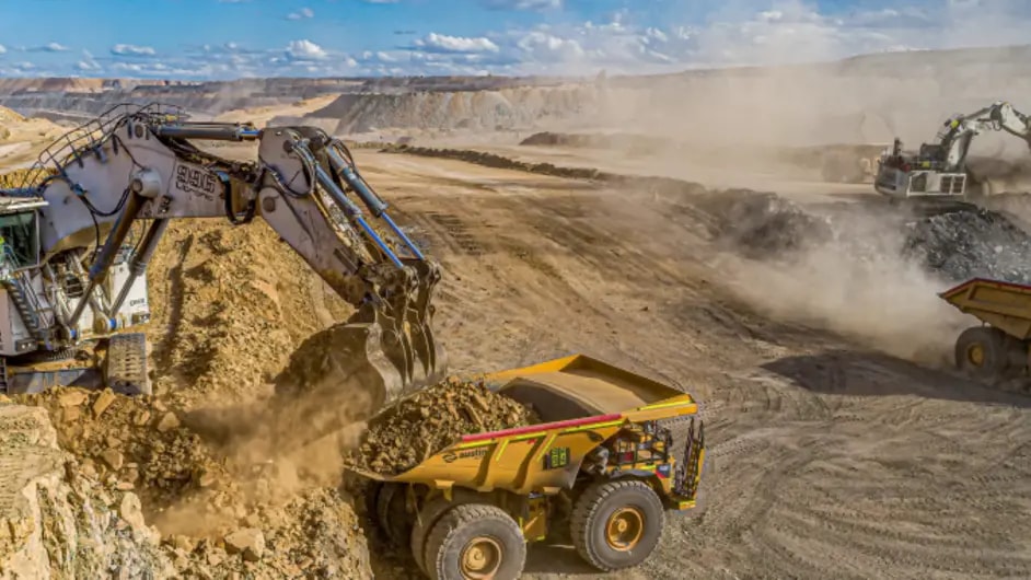 Powerful grabber trucks operating in an open-air mine, adeptly handling materials and contributing to the mining process.