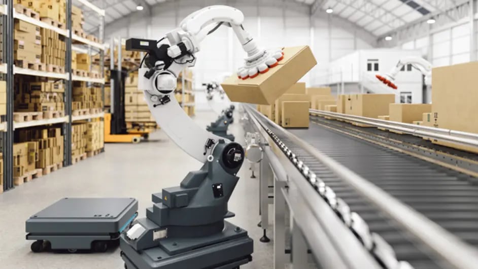 A robot is placing boxes on a conveyor belt in a warehouse