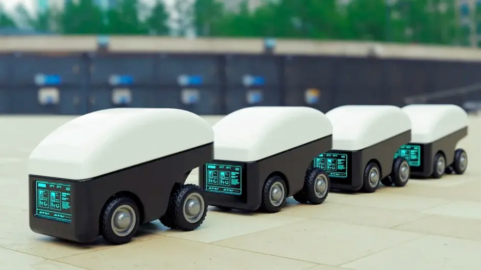 Four small autonomous robotic vehicles lined up in a row